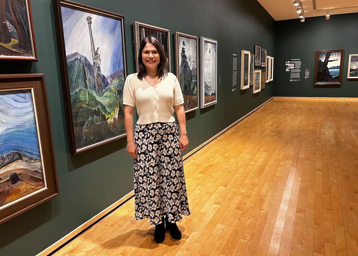 Jasmine Bradley poses with artworks at the Vancouver Art Gallery