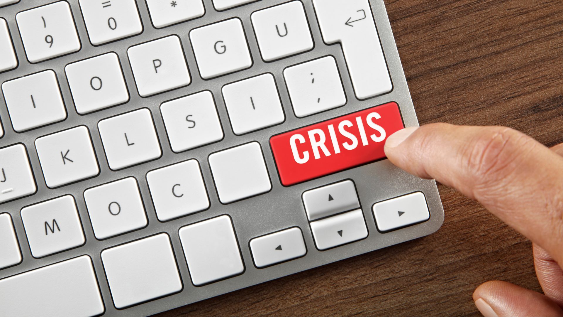 Computer keyboard with a red "Crisis" button on it