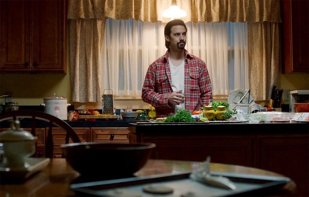 Milo Ventimiglia as Jack Pearson stands behind his kitchen counter in This Is Us